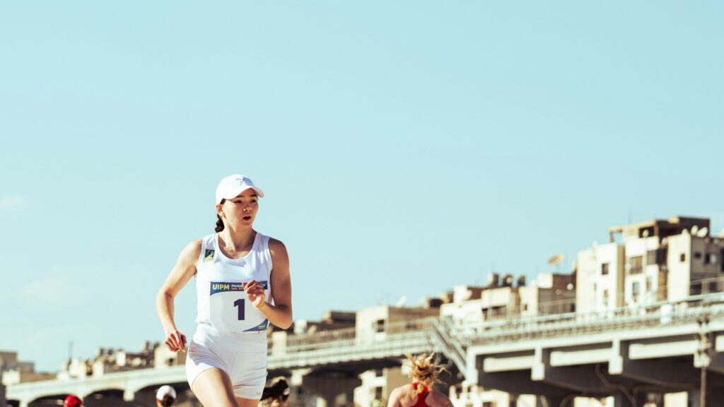 Female Modern Pentathlon Athlete Racing in Competition 4K Wallpaper