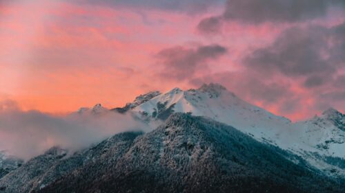 Stunning Pink Sunset Over Snowy Mountain Peaks 4K Desktop Wallpaper