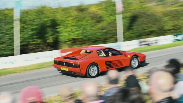 Iconic Red Ferrari Testarossa Racing on Track Desktop Wallpaper