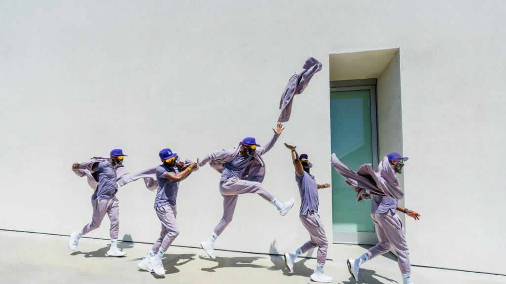 Motion Blur Man in Purple Athletic Wear 4K Desktop Wallpaper