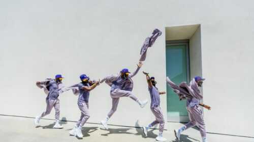 Motion Blur Man in Purple Athletic Wear 4K Desktop Wallpaper