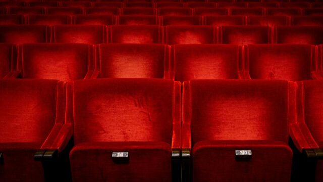 Empty Red Velvet Cinema Theater Seats 4K Desktop Wallpaper