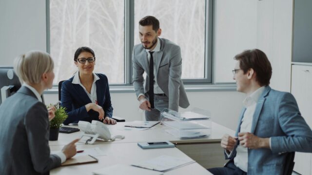 Professional Business Meeting in Modern Office Desktop Wallpaper