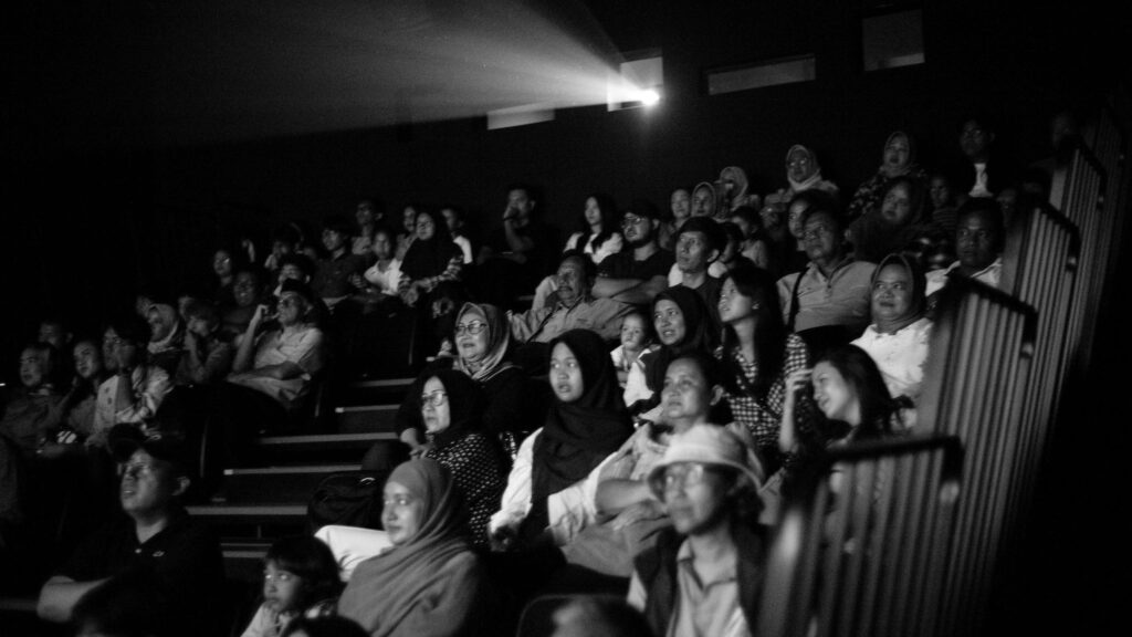 Atmospheric Black and White Movie Theater Audience PC Wallpaper