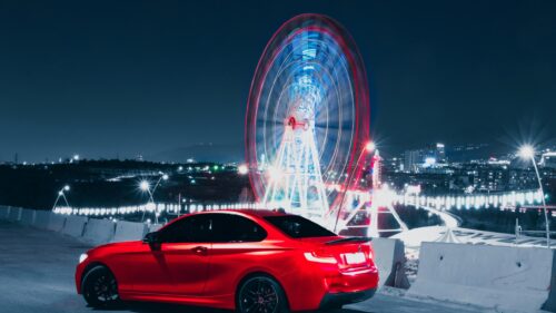 Red BMW 2 Series Coupe at Ferris Wheel Night Cityscape 4K Wallpaper