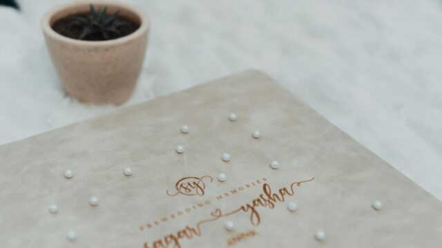 Elegant Pre-Wedding Photo Album with Pearl Accents Desktop Wallpaper