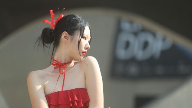 Elegant Asian Woman in Red Dress with Floral Hair Accessory 4K Desktop Wallpaper