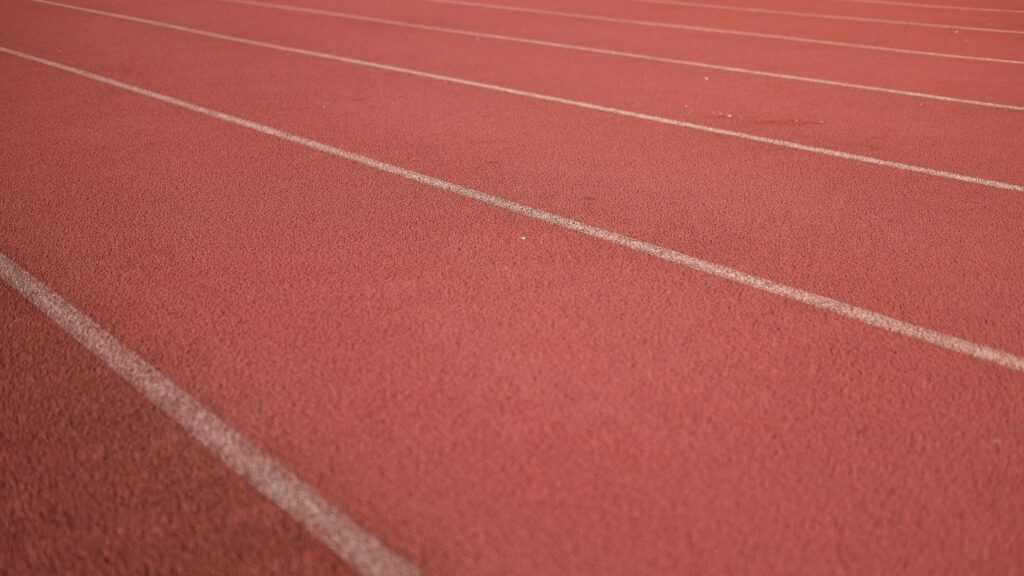 Red Running Track Lines Texture Sports Field 4K Desktop Wallpaper