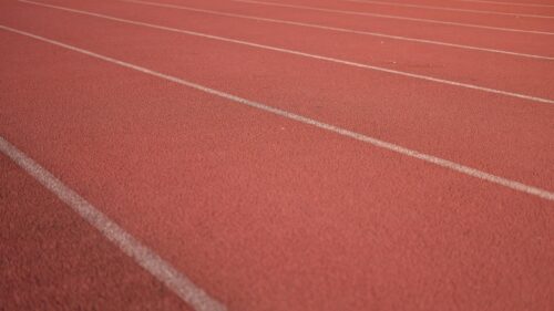 Red Running Track Lines Texture Sports Field 4K Desktop Wallpaper