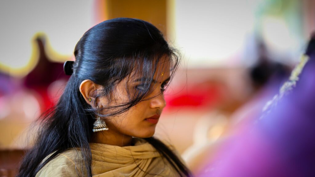 Stunning Close-Up Portrait of an Elegant Woman with Traditional Indian Jewelry 4K Wallpaper
