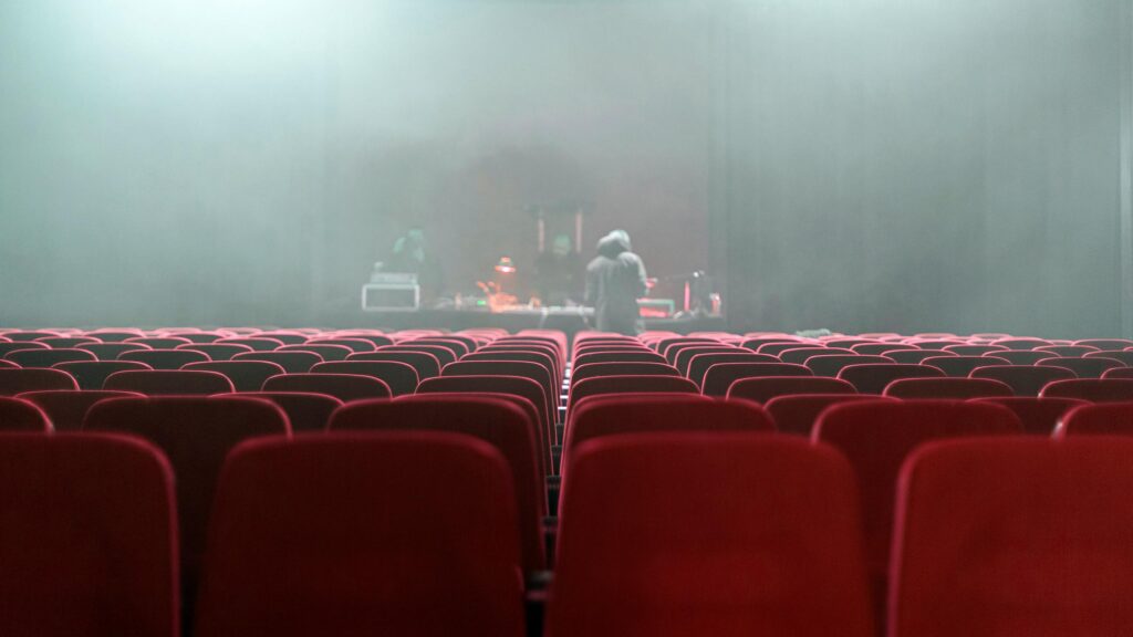 Cinematic Empty Theater with DJ Stage Performance 4K Wallpaper