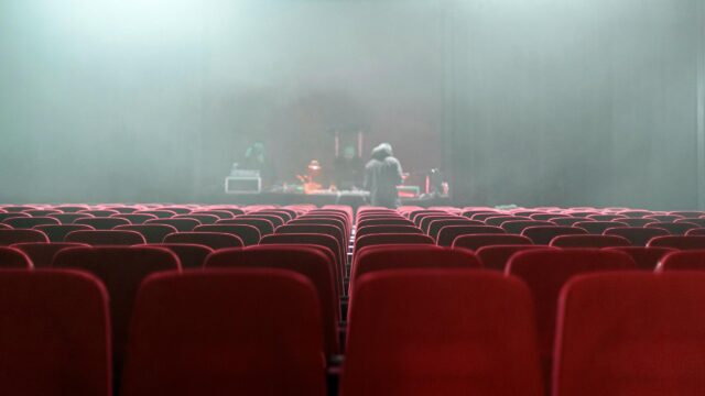 Cinematic Empty Theater with DJ Stage Performance 4K Wallpaper