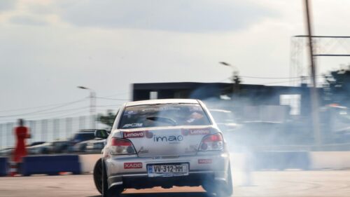 Drifting Silver Subaru WRX Race Car on Track 4K Wallpaper