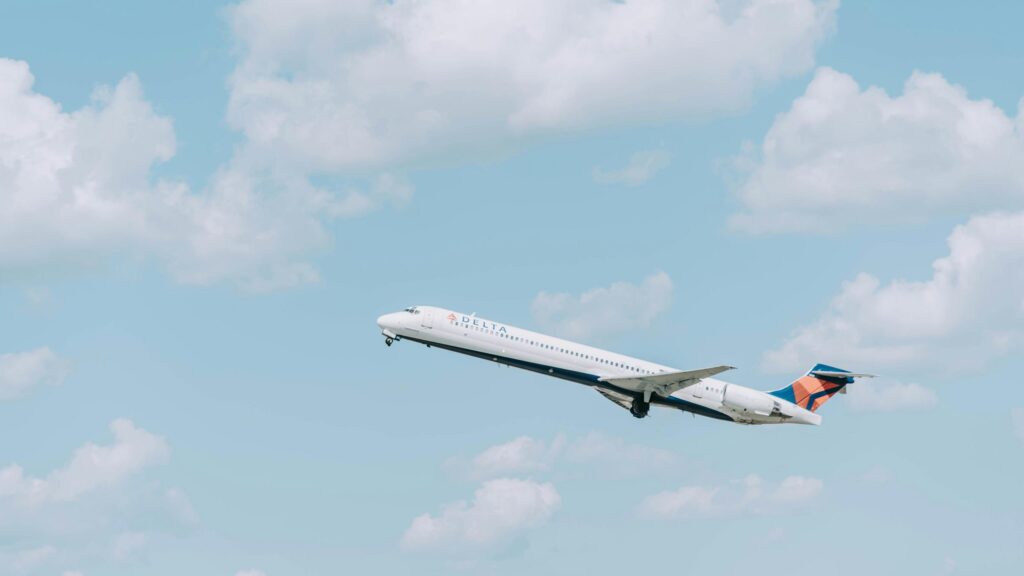 Delta Airlines Jet Taking Off into Blue Skies 4K Wallpaper