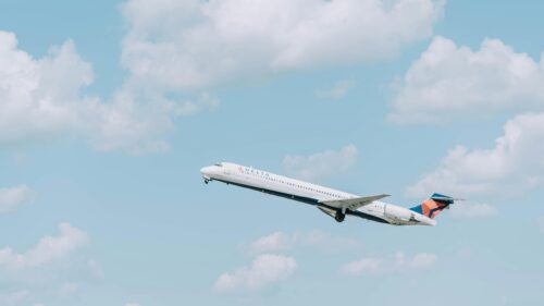 Delta Airlines Jet Taking Off into Blue Skies 4K Wallpaper