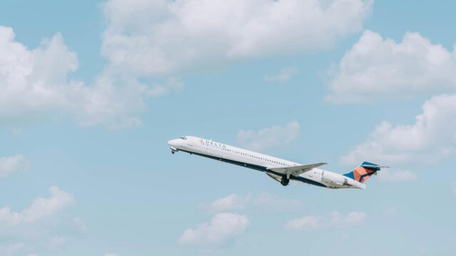 Delta Airlines Jet Taking Off into Blue Skies 4K Wallpaper
