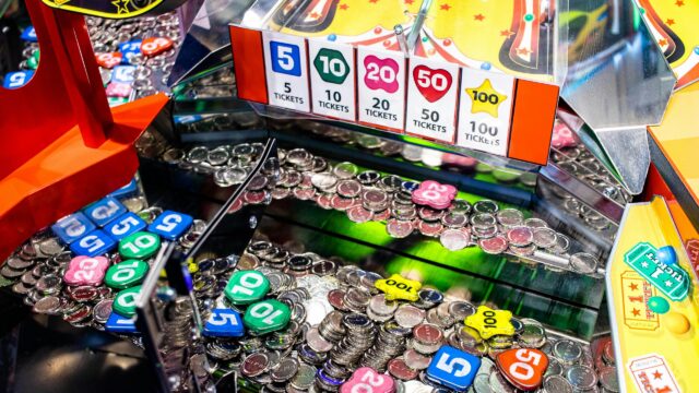Arcade Coin Pusher Game Machine Close Up 4K Wallpaper