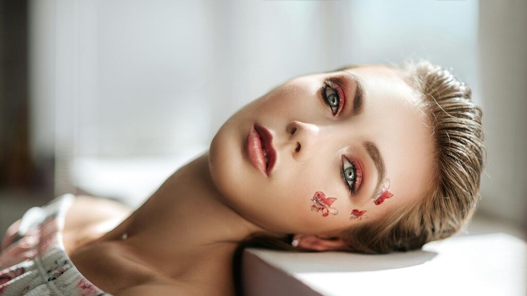 Beautiful Woman with Artistic Goldfish Makeup 4K Desktop Wallpaper