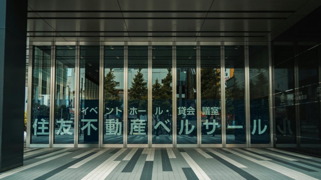 Modern Tokyo Building Entrance Glass Facade 4K Desktop Wallpaper