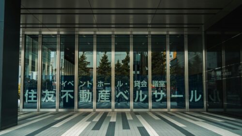 Modern Tokyo Building Entrance Glass Facade 4K Desktop Wallpaper