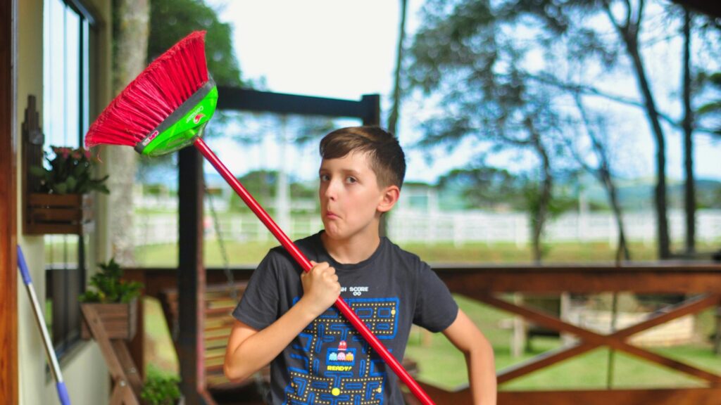 Funny Boy Holding a Red Broomstick Gaming Shirt Portrait Desktop Wallpaper