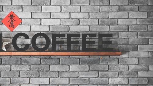 Minimalist Coffee Sign on Industrial Gray Brick Wall Desktop Wallpaper