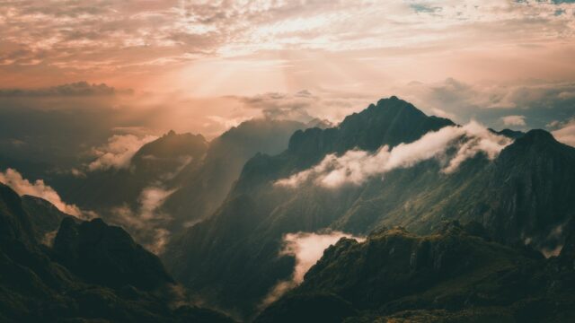 Majestic Mountain Peaks at Golden Sunset 4K Desktop Wallpaper