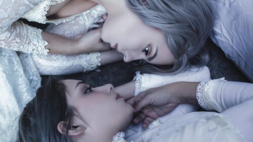 Two Women with Elegant Lace Dresses Lying Together Aesthetic 4K Wallpaper