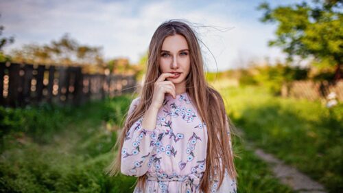 Beautiful Young Woman in Floral Dress Outdoor Portrait 4K Wallpaper