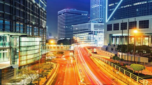 Stunning Night Cityscape with Light Trails and Modern Architecture PC Wallpaper