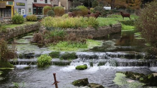 Enchanted Stream and Garden Sculptures in Bourton-on-the-Water 4K Wallpaper