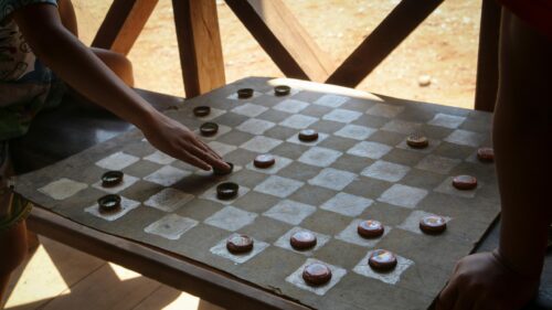 Children Playing Homemade Bottle Cap Checkers Game Desktop Wallpaper