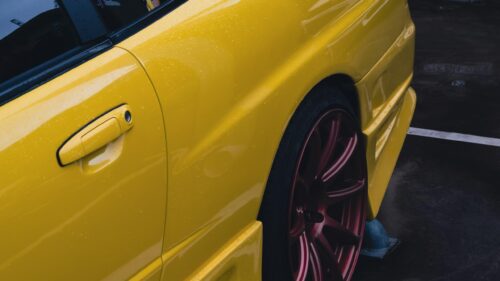 Stunning Yellow JDM Sports Car Rear Quarter View 4K Wallpaper