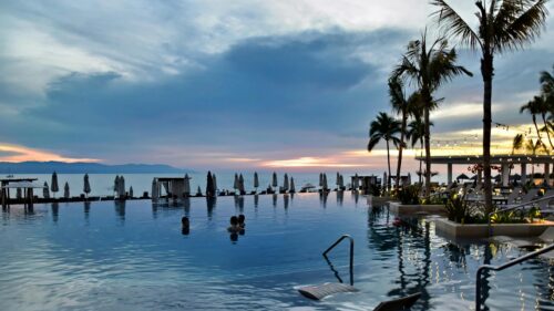Stunning Infinity Pool Sunset Ocean View 4K Desktop Wallpaper