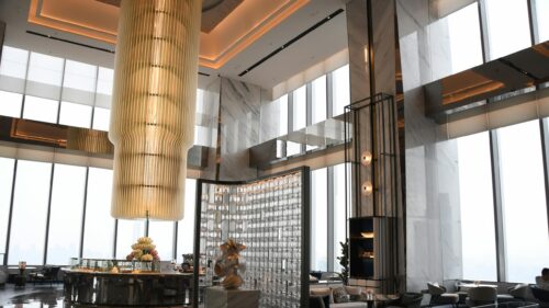 Luxurious Modern Hotel Lobby with Golden Chandelier 4K Wallpaper