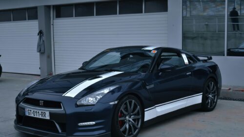 Stunning Dark Blue Nissan GT-R with Racing Stripes Desktop Wallpaper