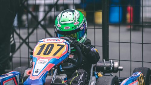 Young Go Kart Racer in Action Helmet 4K Desktop Wallpaper