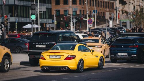 Bright Yellow Mercedes-Benz SL-Class Sports Car Traffic Desktop Wallpaper
