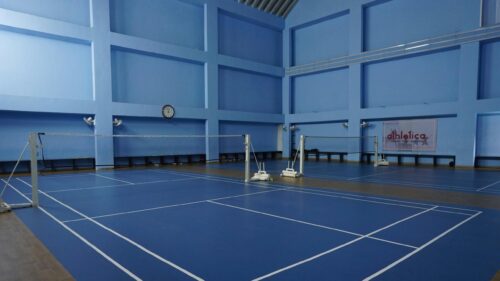 Empty Professional Badminton Indoor Court Blue Arena 4K Wallpaper