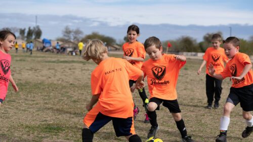 Young Soccer Players in Action on Field 4K Desktop Wallpaper