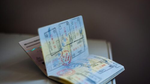 Open Passport with Travel Stamps High Resolution Desktop Wallpaper