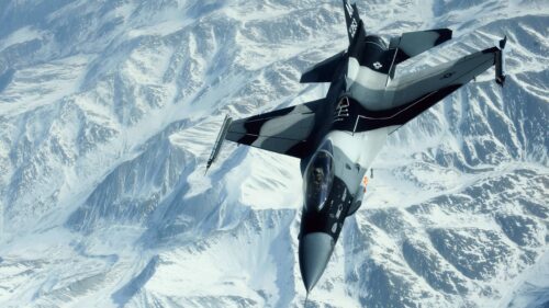 US Air Force F-16 Fighting Falcon Flying Over Snowy Mountains 4K Wallpaper