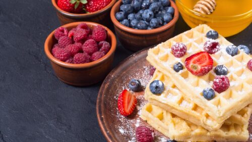 Delicious Belgian Waffles with Fresh Berries and Honey Desktop Wallpaper