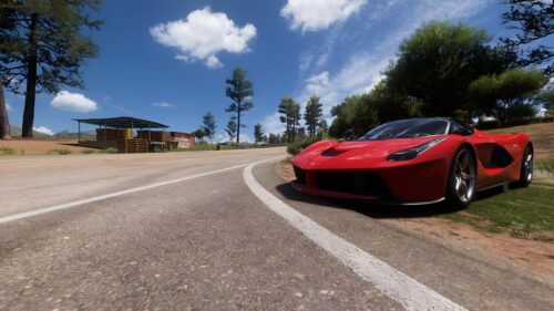 Stunning Red Ferrari LaFerrari Parked on a Sunny Countryside Road 4K Wallpaper