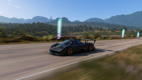 Black Pagani Zonda R Speeding on Scenic Mountain Road PC Wallpaper