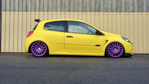 Modified Yellow Renault Clio with Purple Rims Desktop Wallpaper
