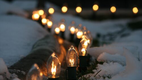 Warm Glowing Christmas Lights in Snowy Garden Desktop Wallpaper