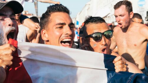 Thrilled Soccer Fans Celebrating France Victory 4K Desktop Wallpaper