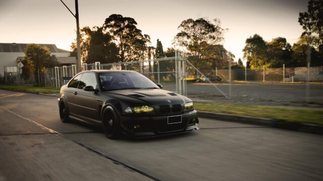 Matte Black Modified BMW E46 M3 with Yellow Headlights 4K Desktop Wallpaper