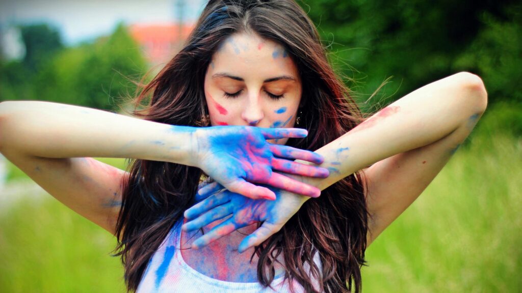 Beautiful Young Woman Covered in Vibrant Holi Festival Colors Desktop Wallpaper